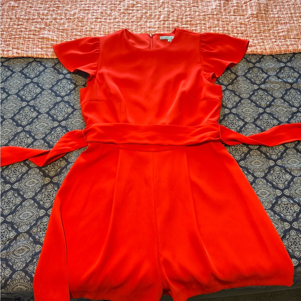 Antonio Melani. Red/Orange flutter sleeve romper. Size:8